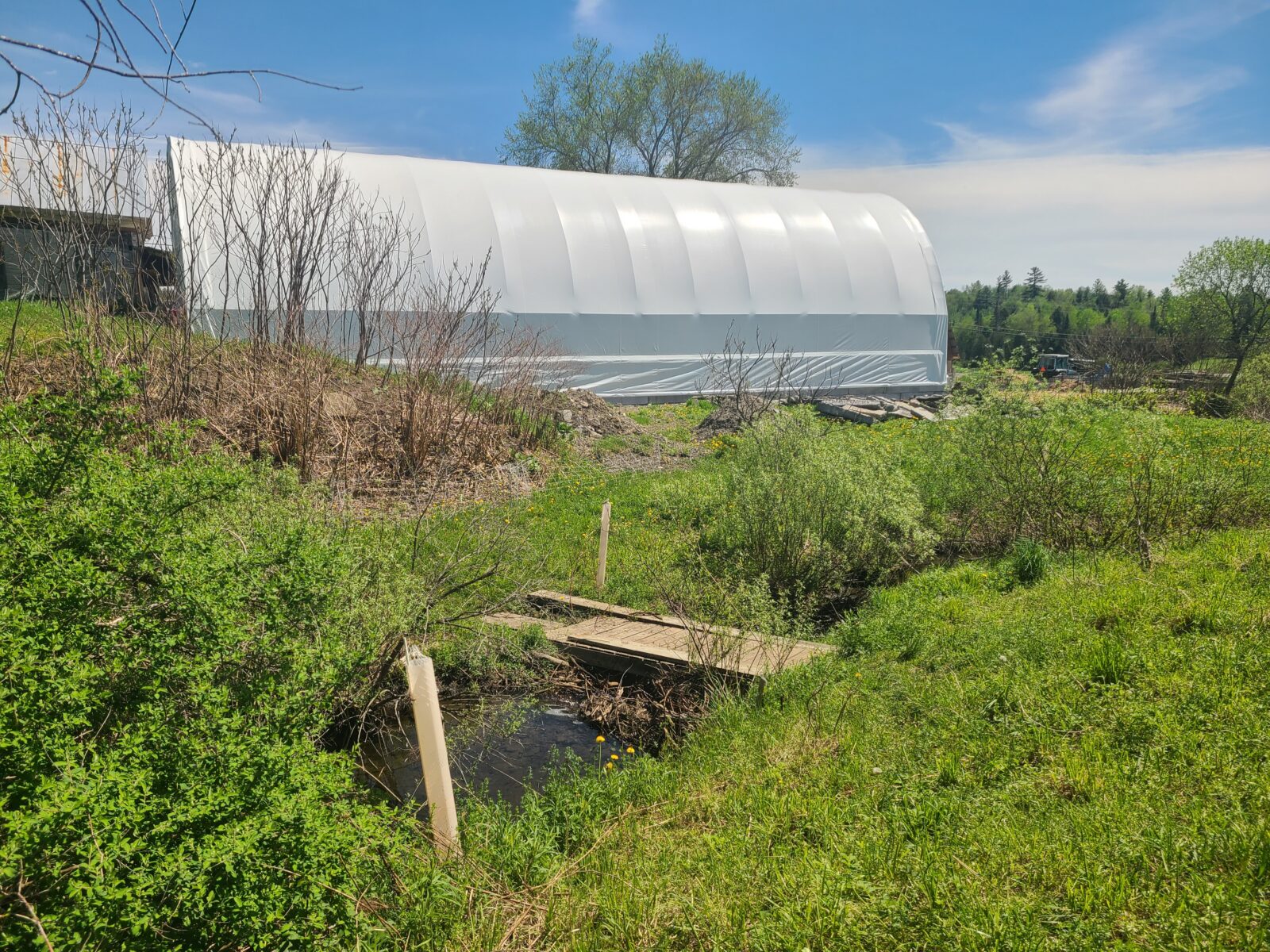 new barn in front of the stream